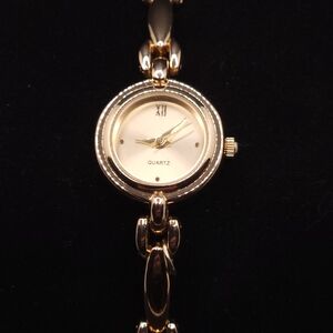 Accutime gold-tone women's quartz analog watch